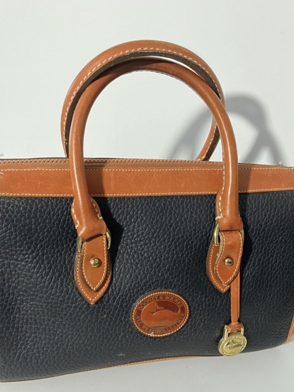 Dooney & Bourke Black with Tan Trim Pebbled Leather Satchel
